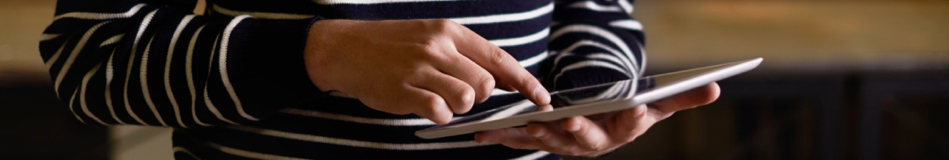 A person holding a tablet